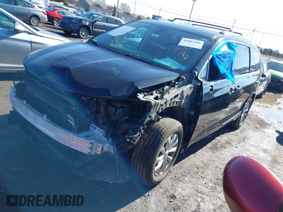 2018 Chrysler Pacifica Touring L with VIN 2C4RC1BGXJR157184, listed as a IAAI auction lot 41803388 with 102,095 mi miles and . Bid and sale history available at DreamBid. Image 17.