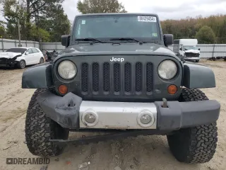 2011 Jeep Wrangler Unlimited Sahara with VIN 1J4BA5H16BL557068, listed as a Copart auction lot 80429454 with 142,428 mi miles and Salvage Title. Bid and sale history available at carsss.com. Image 5.