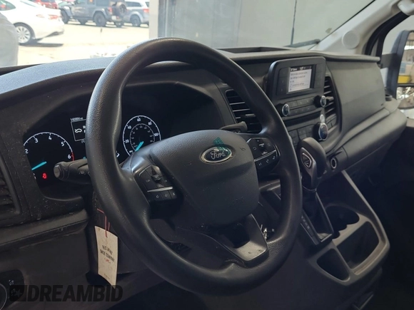 2020 Ford Transit Cargo z VIN 1FTBR1XG3LKB79165, wystawiony jako IAAI lot #42763042 z przebiegiem 140 992 mil mil oraz . Historia ofert i sprzedaży dostępna na DreamBid. Obrazek 36.