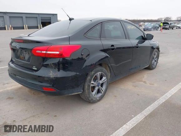 2017 Ford Focus SE with VIN 1FADP3FE4HL307110, listed as a IAAI auction lot 41992037 with 54,380 mi miles and . Bid and sale history available at DreamBid. Image 4.