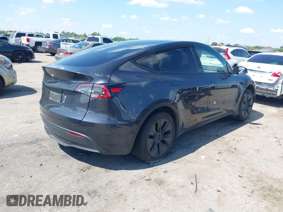 2024 Tesla Model Y with VIN 7SAYGDED9RA321373, listed as a IAAI auction lot 42228491 with 6,452 mi miles and . Bid and sale history available at DreamBid. Image 4.