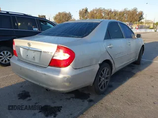 2004 Toyota Camry LE with VIN 4T1BE32K34U307084, listed as a IAAI auction lot 41960265 with 249,222 mi miles. Bid and sale history available at carsss.com. Image 4.