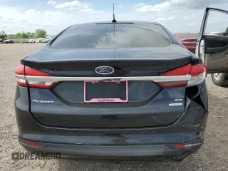 2018 Ford Fusion SE z VIN 3FA6P0HD8JR217719, wystawiony jako Copart lot #53429555 z przebiegiem 108 953 mil mil oraz Szkoda całkowita • Salvage title. Historia ofert i sprzedaży dostępna na DreamBid. Obrazek 6.
