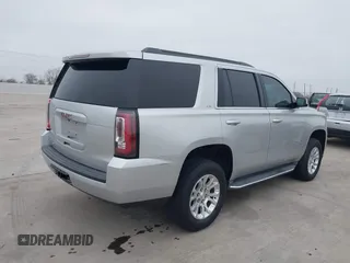 2015 GMC Yukon SLT with VIN 1GKS1BKC3FR253184, listed as a IAAI auction lot 41574610 with 152,543 mi miles. Bid and sale history available at carsss.com. Image 4.