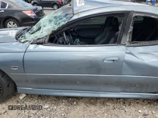 2005 Pontiac GTO z VIN 6G2VX12UX5L352121, wystawiony jako Copart lot #56840425 z przebiegiem 42 265 mil mil oraz Szkody całkowita. Historia ofert i sprzedaży dostępna na DreamBid. Obrazek 7.