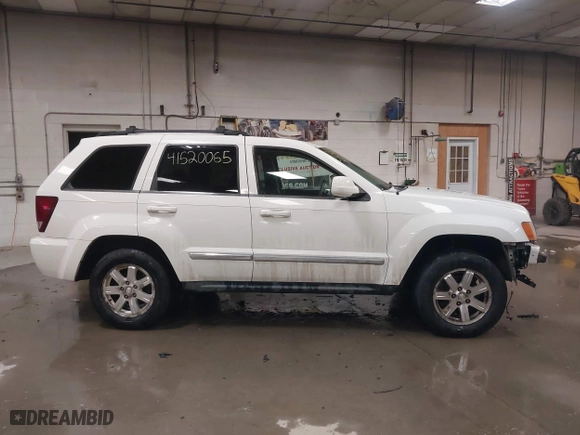 2009 Jeep Grand Cherokee Limited with VIN 1J8GR58K29C553812, listed as a IAAI auction lot 41520065 with 203,595 mi miles. Bid and sale history available at carsss.com. Image 14.