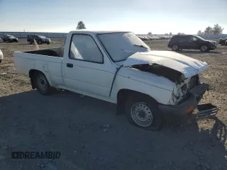 1990 Toyota Pickup with VIN JT4RN81R1L0049863, listed as a Copart auction lot 42832405 with 230,913 mi miles and Salvage title. Bid and sale history available at DreamBid. Image 4.