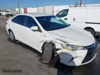 2015 Toyota Camry Hybrid LE with VIN 4T1BD1FK2FU151740, listed as a IAAI auction lot 41406014 with 113,510 mi miles. Bid and sale history available at carsss.com. Image 1.