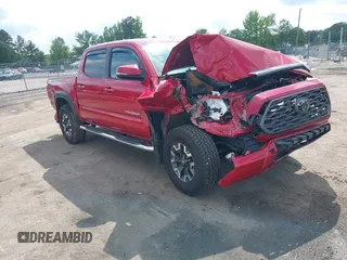 2021 Toyota Tacoma SR z VIN 5TFCZ5AN2MX263159, wystawiony jako IAAI lot #42273087 z przebiegiem 69 220 mil mil oraz . Historia ofert i sprzedaży dostępna na DreamBid. Obrazek 1.