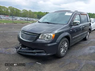 2014 Chrysler Town & Country Touring L with VIN 2C4RC1CG6ER195502, listed as a IAAI auction lot 42009629 with 126,157 mi miles and . Bid and sale history available at DreamBid. Image 2.