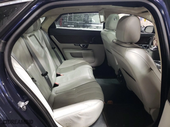 2014 Jaguar XJ with VIN SAJWJ2GD5E8V69562, listed as a Copart auction lot 87737195 with 100,525 mi miles and Salvage Title. Bid and sale history available at carsss.com. Image 10.