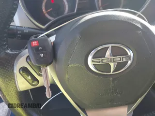 2014 Scion tC with VIN JTKJF5C78E3079618, listed as a IAAI auction lot 41107330 with 112,105 mi miles. Bid and sale history available at carsss.com. Image 11.