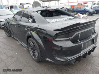2022 Dodge Charger Scat Pack Widebody with VIN 2C3CDXGJ4NH159524, listed as a IAAI auction lot 41506983 with 66,750 mi miles. Bid and sale history available at carsss.com. Image 3.
