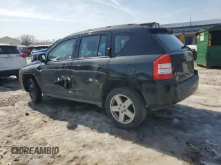 2010 Jeep Compass Sport with VIN 1J4NF4FB2AD591523, listed as a Copart auction lot 48809775 with 105,720 mi miles and Salvage Title. Bid and sale history available at carsss.com. Image 2.