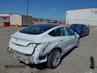 2023 Tesla Model 3 with VIN 5YJ3E1EA7PF592966, listed as a IAAI auction lot 41879794 with 13,423 mi miles and . Bid and sale history available at carsss.com. Image 6.