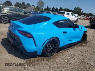 2021 Toyota GR Supra 2.0 with VIN WZ1DB2C04MW039858, listed as a Copart auction lot 70049874 with 10,586 mi miles and Salvage Title. Bid and sale history available at carsss.com. Image 3.