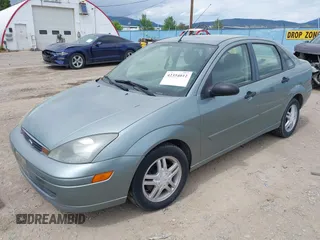 2003 Ford Focus SE z VIN 1FAFP34PX3W135265, wystawiony jako IAAI lot #42354012 z przebiegiem 79 617 mil mil oraz . Historia ofert i sprzedaży dostępna na DreamBid. Obrazek 2.