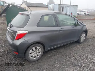 2013 Toyota Yaris L with VIN JTDJTUD39DD560766, listed as a IAAI auction lot 41031127 with 57,831 mi miles. Bid and sale history available at carsss.com. Image 4.