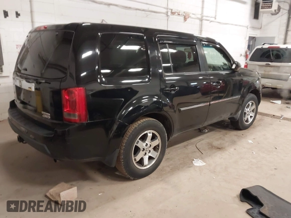2009 Honda Pilot Touring with VIN 5FNYF48939B041166, listed as a IAAI auction lot 42098397 with 228,305 mi miles and . Bid and sale history available at carsss.com. Image 4.
