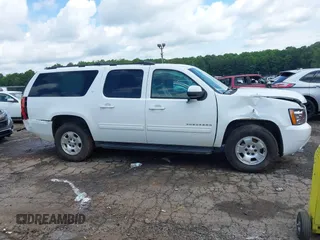 2014 Chevrolet Suburban LT with VIN 1GNSCJE07ER211222, listed as a IAAI auction lot 42428084 with 214,712 mi miles and . Bid and sale history available at DreamBid. Image 13.
