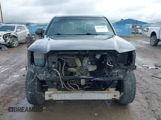 2013 Toyota Tacoma with VIN 3TMLU4EN7DM113315, listed as a IAAI auction lot 41938415 with 228,912 mi miles and . Bid and sale history available at DreamBid. Image 6.