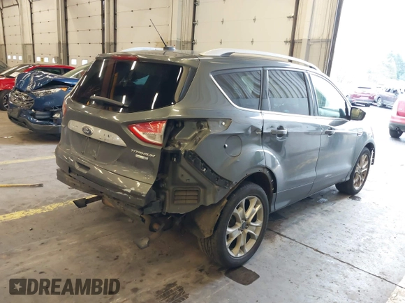 2016 Ford Escape Titanium with VIN 1FMCU9J92GUB63525, listed as a IAAI auction lot 41469824 with 156,773 mi miles. Bid and sale history available at carsss.com. Image 4.