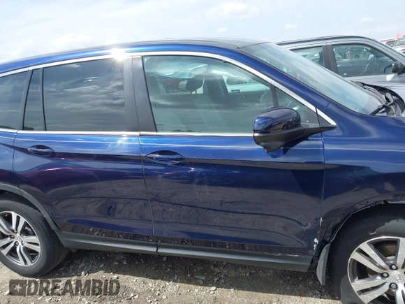 2018 Honda Pilot EX-L with VIN 5FNYF5H5XJB025960, listed as a IAAI auction lot 41843520 with 23,404 mi miles and . Bid and sale history available at DreamBid. Image 13.