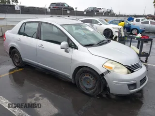 2009 Nissan Versa 1.8 S with VIN 3N1BC11E39L364397, listed as a IAAI auction lot 41788772 with 223,959 mi miles. Bid and sale history available at carsss.com. Image 1.