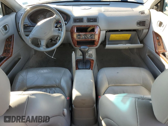 2000 Mitsubishi Galant LS with VIN 4A3AA56LXYE174881, listed as a Copart auction lot 79727154 with 106,001 mi miles and Salvage Title. Bid and sale history available at carsss.com. Image 8.