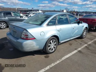 2008 Ford Taurus SEL with VIN 1FAHP27WX8G157077, listed as a IAAI auction lot 41499882 with 113,039 mi miles. Bid and sale history available at carsss.com. Image 4.