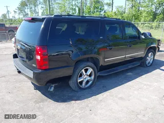 2011 Chevrolet Suburban LTZ with VIN 1GNSCKE01BR275919, listed as a IAAI auction lot 42038399 with 247,841 mi miles. Bid and sale history available at carsss.com. Image 4.