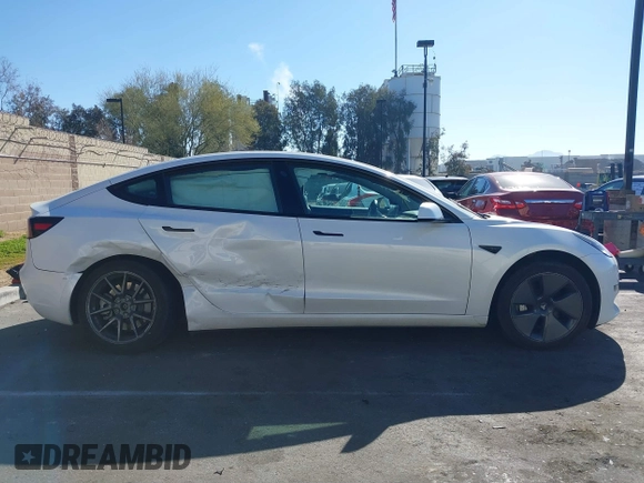 2023 Tesla Model 3 with VIN 5YJ3E1EA6PF411940, listed as a IAAI auction lot 41829537 with 32,877 mi miles and . Bid and sale history available at carsss.com. Image 12.