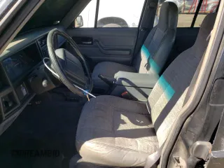 1996 Jeep Cherokee Sport with VIN 1J4FJ68S1TL317265, listed as a Copart auction lot 46427625 with 265,554 mi miles and Clean Title. Bid and sale history available at carsss.com. Image 7.