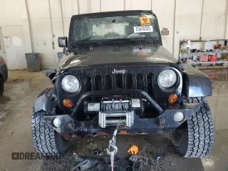 2009 Jeep Wrangler Sahara with VIN 1J4FA54159L772622, listed as a Copart auction lot 55648305 with 141,880 mi miles and Salvage title. Bid and sale history available at DreamBid. Image 5.