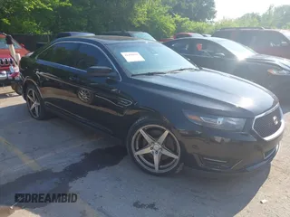 2013 Ford Taurus SHO z VIN 1FAHP2KT5DG229598, wystawiony jako IAAI lot #42459933 z przebiegiem 105 177 mil mil oraz . Historia ofert i sprzedaży dostępna na DreamBid. Obrazek 1.