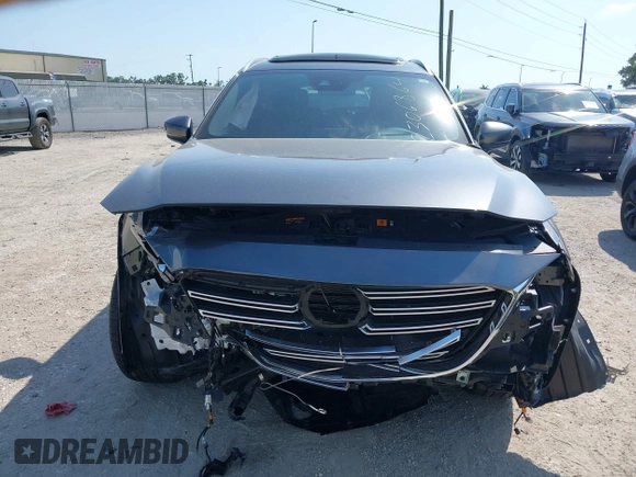 2020 Mazda CX-9 Grand Touring z VIN JM3TCADY8L0417775, wystawiony jako IAAI lot #42306864 z przebiegiem 35 287 mil mil oraz . Historia ofert i sprzedaży dostępna na DreamBid. Obrazek 13.