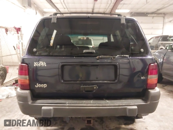1997 Jeep Grand Cherokee Laredo with VIN 1J4GZ58S8VC675487, listed as a IAAI auction lot 41034046 with 243,284 mi miles. Bid and sale history available at carsss.com. Image 16.