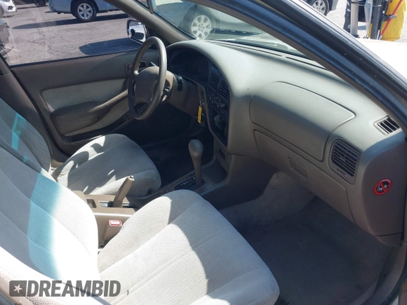 1996 Toyota Camry DX z VIN JT2BG12K0T0347950, wystawiony jako IAAI lot #42248890 z przebiegiem 264 017 mil mil oraz . Historia ofert i sprzedaży dostępna na DreamBid. Obrazek 5.