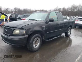 2002 Ford F-150 XL with VIN 1FTRX17W92NA80214, listed as a IAAI auction lot 41074951 with 164,048 mi miles. Bid and sale history available at carsss.com. Image 2.