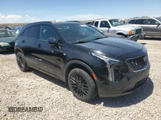 2019 Cadillac XT4 AWD Sport z VIN 1GYFZFR47KF152344, wystawiony jako Copart lot #57535655 z przebiegiem 70 107 mil mil oraz Szkody całkowita. Historia ofert i sprzedaży dostępna na DreamBid. Obrazek 4.