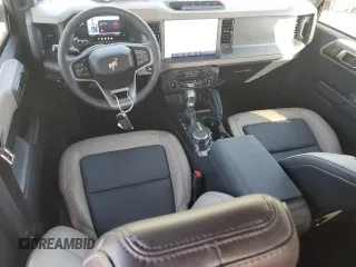 2024 Ford Bronco Wildtrak с VIN 1FMEE2BPXRLB16732, выставлен на аукционе Copart как лот 56394005 с пробегом 8 428 миль миль и Списание • Salvage title. История ставок и продаж доступна на DreamBid. Изображение 8.