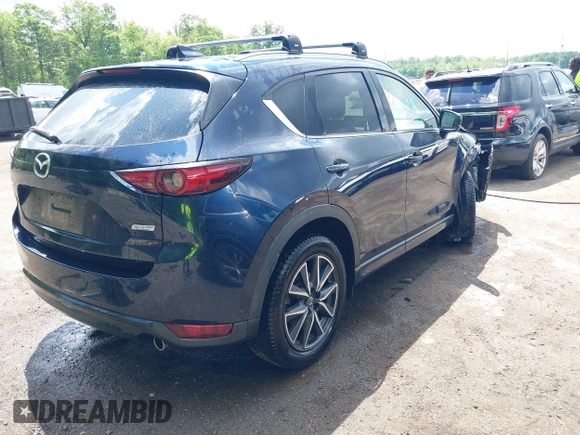 2018 Mazda CX-5 Grand Touring with VIN JM3KFBDM2J0373386, listed as a IAAI auction lot 42200795 with 70,111 mi miles and . Bid and sale history available at DreamBid. Image 4.