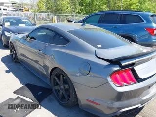 2021 Ford Mustang EcoBoost with VIN 1FA6P8TH3M5100601, listed as a IAAI auction lot 42060948 with 79,677 mi miles and . Bid and sale history available at DreamBid. Image 3.