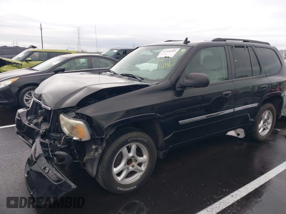 2007 GMC Envoy SLE with VIN 1GKDS13S872309605, listed as a IAAI auction lot 41946509 with 184,638 mi miles. Bid and sale history available at carsss.com. Image 2.