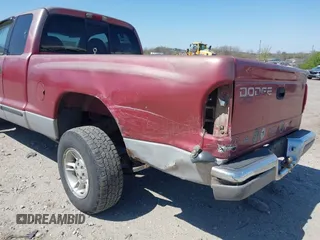 1999 Dodge Dakota SLT z VIN 1B7GL22X2XS222162, wystawiony jako IAAI lot #42038943 z przebiegiem 222 883 mil mil oraz . Historia ofert i sprzedaży dostępna na DreamBid. Obrazek 6.