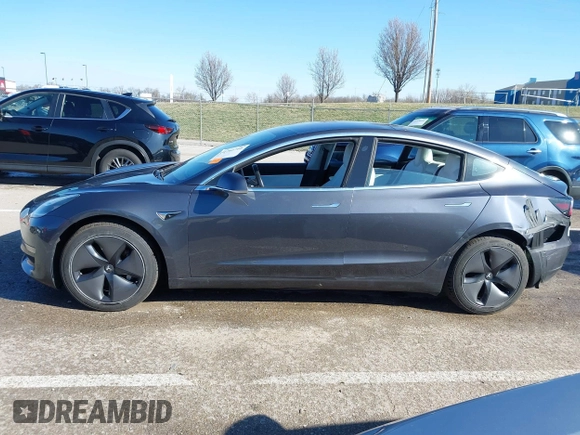 2018 Tesla Model 3 Long Range Battery with VIN 5YJ3E1EB6JF122167, listed as a IAAI auction lot 41761710 with 76,199 mi miles and . Bid and sale history available at DreamBid. Image 14.