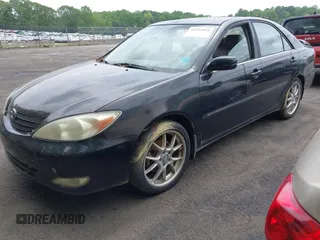 2003 Toyota Camry LE with VIN JTDBF32K430146557, listed as a IAAI auction lot 42102454 with 179,653 mi miles. Bid and sale history available at carsss.com. Image 2.