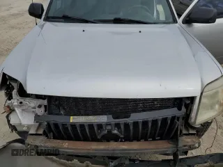 2011 Mercury Mariner z VIN 4M2CN8B73BKJ06886, wystawiony jako Copart lot #50308485 z przebiegiem 118 584 mil mil oraz Szkoda całkowita • Salvage title. Historia ofert i sprzedaży dostępna na DreamBid. Obrazek 13.