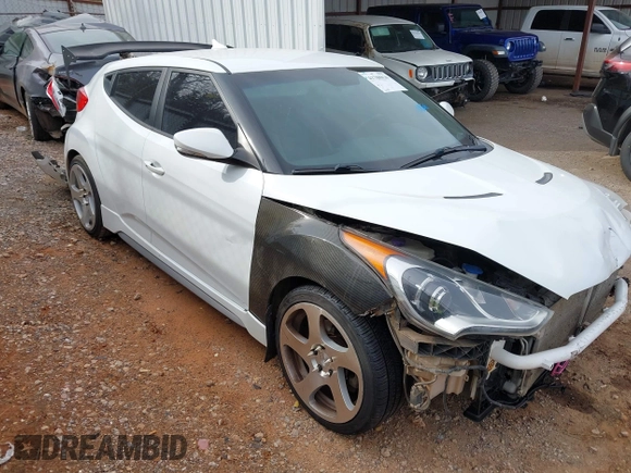 2013 Hyundai Veloster Turbo z VIN KMHTC6AE2DU128607, wystawiony jako IAAI lot #41788836 z przebiegiem 115 500 mil mil oraz . Historia ofert i sprzedaży dostępna na DreamBid. Obrazek 1.