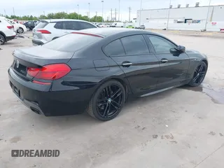 2014 BMW 6 Series 650i z VIN WBA6B2C55ED129419, wystawiony jako IAAI lot #39061341 z przebiegiem 68 790 mil mil oraz . Historia ofert i sprzedaży dostępna na DreamBid. Obrazek 4.